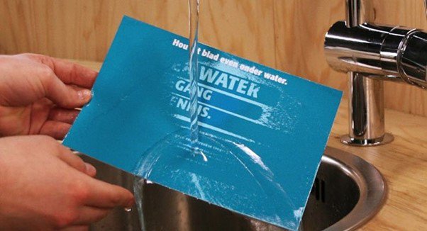 Image of World Water Day mailer under a running tap revealing a message